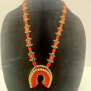 Squash blossom faux coral colored beaded necklace